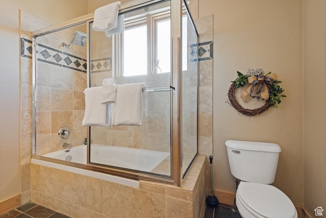 3995 N Timberwolf Ln Unit 1A, Park City, UT 84098 - full bath featuring tiled shower / bath combo, tile patterned flooring, toilet, and baseboards