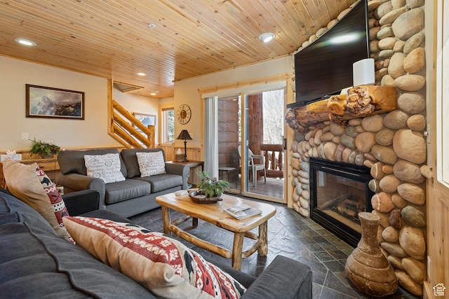 3995 N Timberwolf Ln Unit 1A, Park City, UT 84098 - living area with a fireplace, recessed lighting, stone tile flooring, stairway, and wooden ceiling