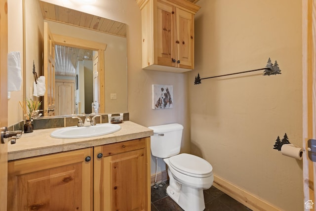 3995 N Timberwolf Ln Unit 1A, Park City, UT 84098 - bathroom featuring tile patterned flooring, baseboards, vanity, and toilet