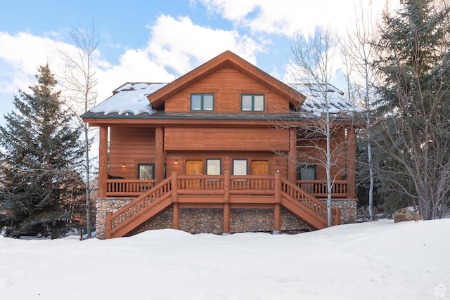 3995 N Timberwolf Ln Unit 1A, Park City, UT 84098 - snow covered back of property featuring stairs and a porch