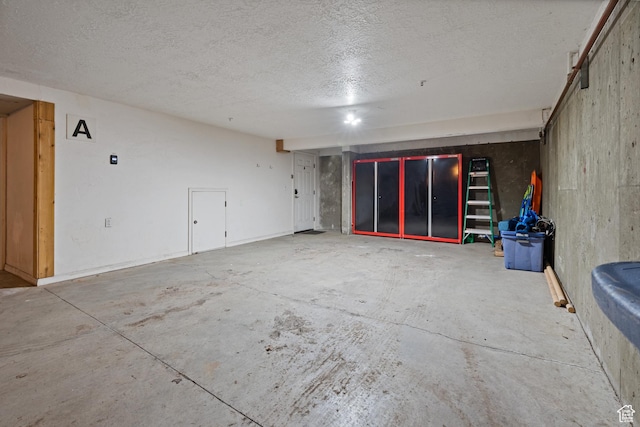 3995 N Timberwolf Ln Unit 1A, Park City, UT 84098 - empty room with concrete floors and a textured ceiling