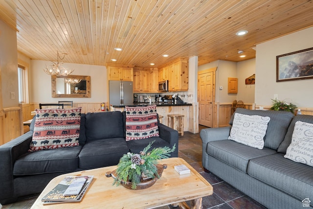 3995 N Timberwolf Ln Unit 1A, Park City, UT 84098 - living area with wainscoting, wooden ceiling, stone finish floor, an inviting chandelier, and recessed lighting