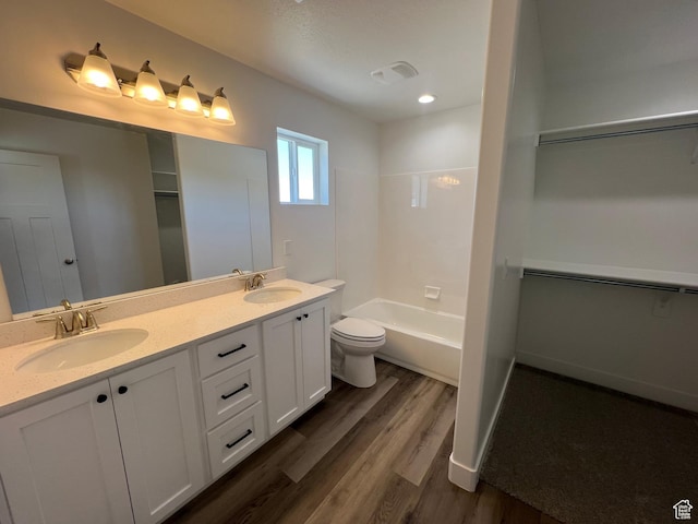14 E 300 S, Delta, UT 84624 - bathroom featuring toilet, double vanity, a sink, and wood finished floors