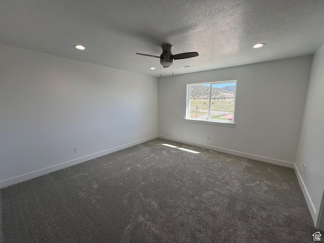 14 E 300 S, Delta, UT 84624 - spare room with recessed lighting, dark carpet, ceiling fan, a textured ceiling, and baseboards