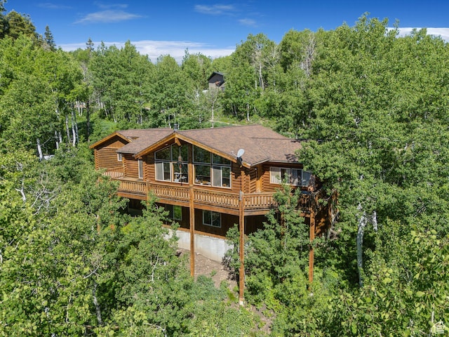 1973 W Modoc Loop, Coalville, UT 84017 - back of property with log exterior and a wooden deck