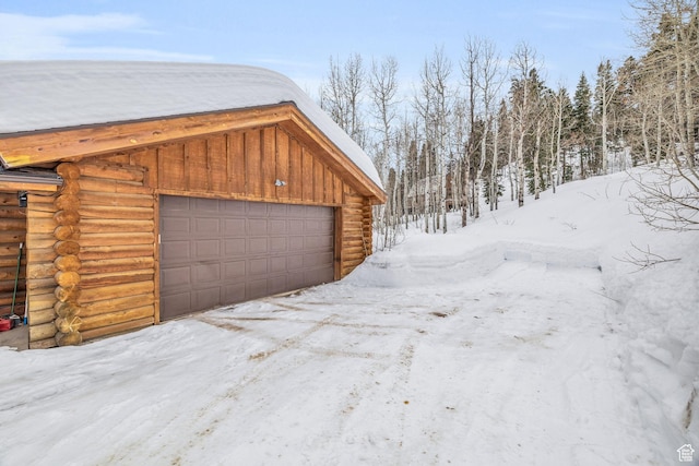 1973 W Modoc Loop, Coalville, UT 84017 - snow covered garage featuring a garage