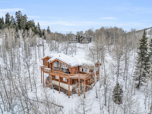 1973 W Modoc Loop, Coalville, UT 84017 - snow covered property featuring log siding and a deck