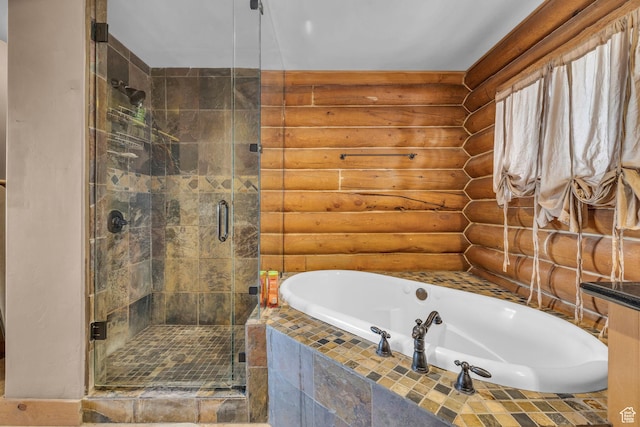 1973 W Modoc Loop, Coalville, UT 84017 - bathroom featuring a garden tub, log walls, and a stall shower