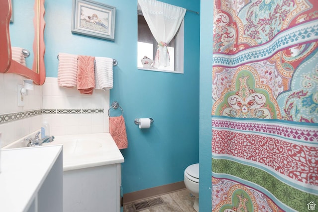 86 E 1000 S, Panguitch, UT 84759 - full bath with baseboards, visible vents, vanity, and toilet