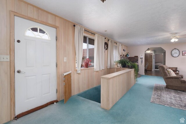 86 E 1000 S, Panguitch, UT 84759 - foyer with carpet, ceiling fan, and wooden walls