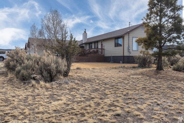 86 E 1000 S, Panguitch, UT 84759 - exterior space featuring a chimney and a deck