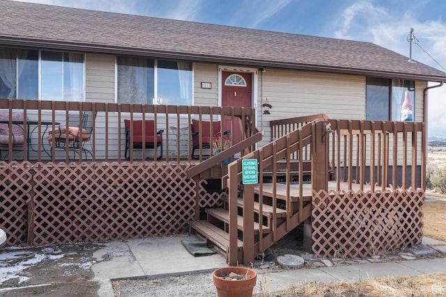 86 E 1000 S, Panguitch, UT 84759 - view of exterior entry with a deck and a shingled roof