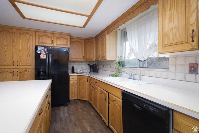 86 E 1000 S, Panguitch, UT 84759 - kitchen featuring dark wood-style flooring, a sink, light countertops, decorative backsplash, and black appliances