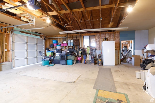 86 E 1000 S, Panguitch, UT 84759 - garage with freestanding refrigerator and a garage door opener