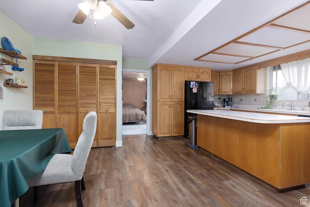 86 E 1000 S, Panguitch, UT 84759 - kitchen featuring a ceiling fan, decorative backsplash, light countertops, and dark wood-type flooring