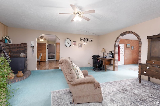 86 E 1000 S, Panguitch, UT 84759 - living area featuring ceiling fan, arched walkways, and a textured ceiling