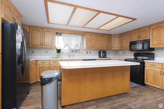 86 E 1000 S, Panguitch, UT 84759 - kitchen with dark wood-style floors, black appliances, light countertops, and a center island
