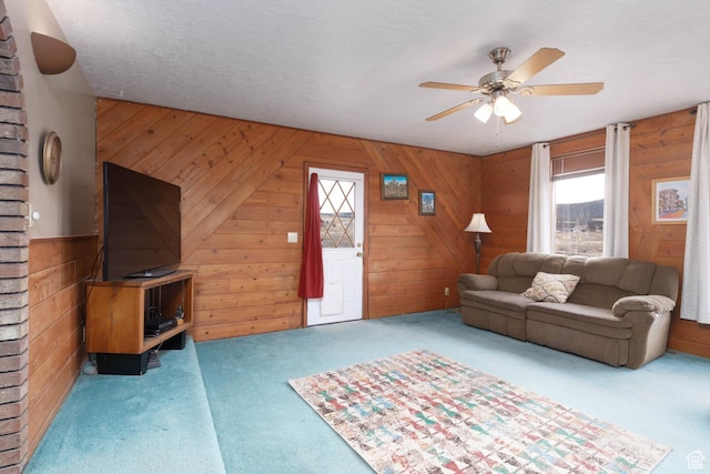 86 E 1000 S, Panguitch, UT 84759 - living area with carpet floors, wood walls, and a textured ceiling