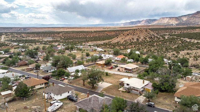 138 W 100 N, East Carbon, UT 84520 - aerial view of property and surrounding area featuring mountains and nearby suburban area