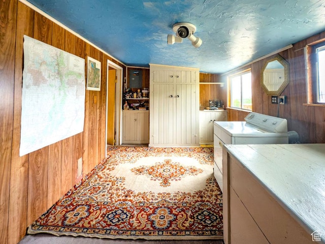 138 W 100 N, East Carbon, UT 84520 - laundry room featuring wooden walls and washer and clothes dryer
