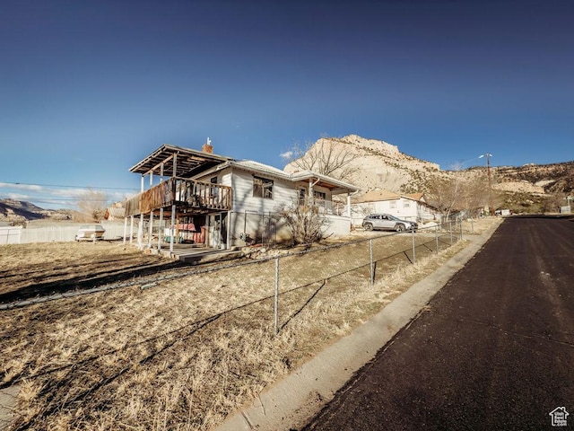 138 W 100 N, East Carbon, UT 84520 - view of front of house featuring a mountain view and fence
