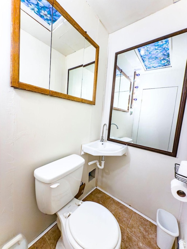 138 W 100 N, East Carbon, UT 84520 - half bathroom with a skylight and tile patterned flooring
