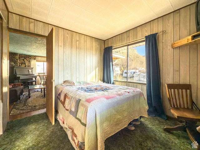 138 W 100 N, East Carbon, UT 84520 - bedroom with dark colored carpet and wood walls