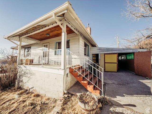 138 W 100 N, East Carbon, UT 84520 - back of property with a porch and a chimney