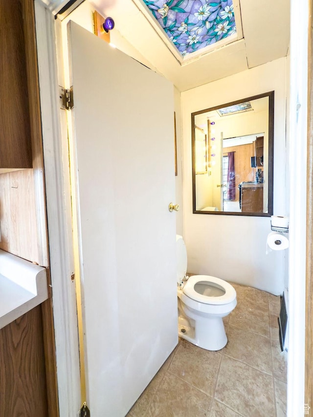 138 W 100 N, East Carbon, UT 84520 - half bath featuring tile patterned floors and toilet