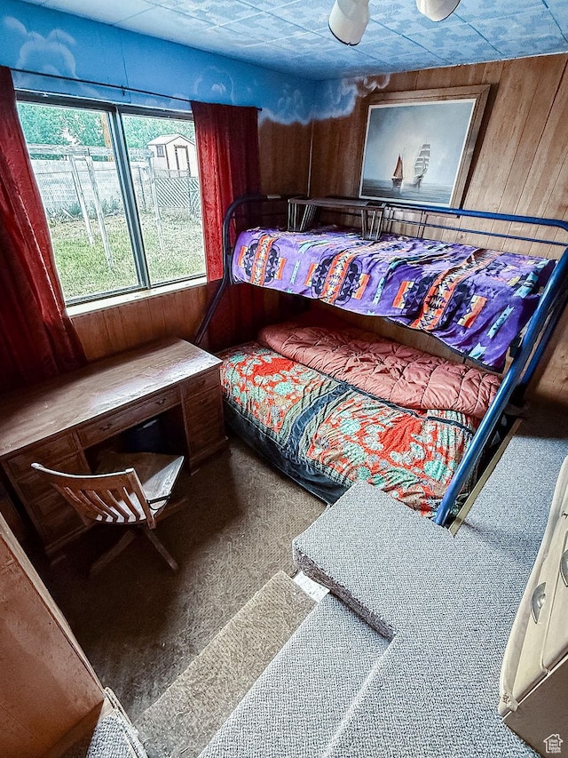 138 W 100 N, East Carbon, UT 84520 - bedroom featuring wood walls and carpet