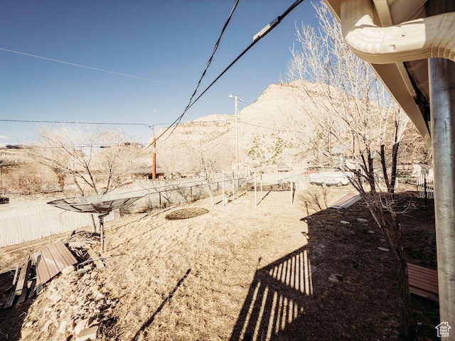 138 W 100 N, East Carbon, UT 84520 - view of yard featuring a mountain view and fence
