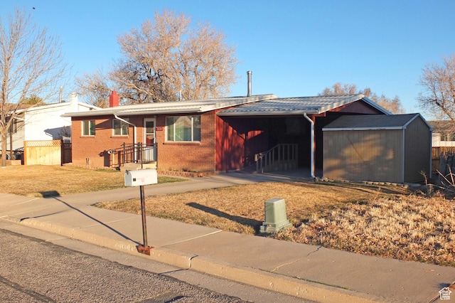 1120 Bulloch Cir, Cedar City, UT 84721 - ranch-style house with fence, an outdoor structure, and brick siding