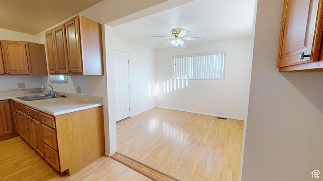 1120 Bulloch Cir, Cedar City, UT 84721 - kitchen with ceiling fan, light wood-style flooring, a sink, baseboards, and light countertops