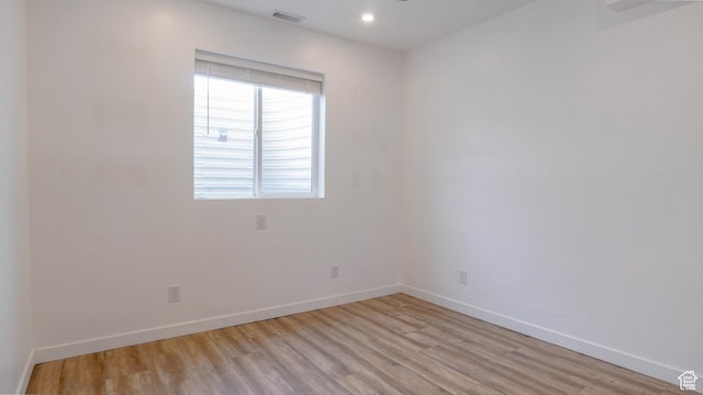 unfurnished room featuring recessed lighting, visible vents, baseboards, and light wood finished floors