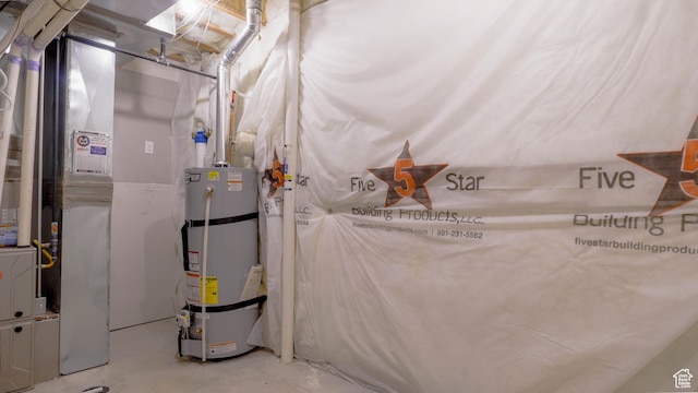 utility room featuring secured water heater