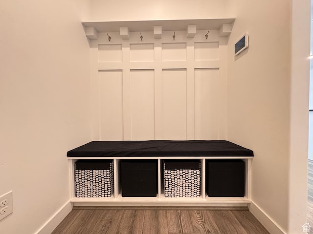 mudroom with baseboards and wood finished floors