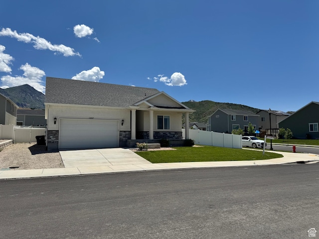 1207 S Raintree Ln, Santaquin, UT 84655 - view of front of property with an attached garage, stucco siding, concrete driveway, a residential view, and stone siding