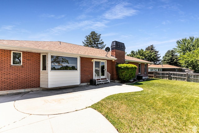 1963 E Rio Way E, Sandy, UT 84093 - view of front facade featuring entry steps, brick siding, a patio, and a chimney