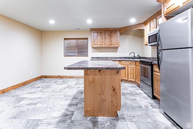 1963 E Rio Way E, Sandy, UT 84093 - kitchen with appliances with stainless steel finishes, a center island, recessed lighting, dark countertops, and light brown cabinetry