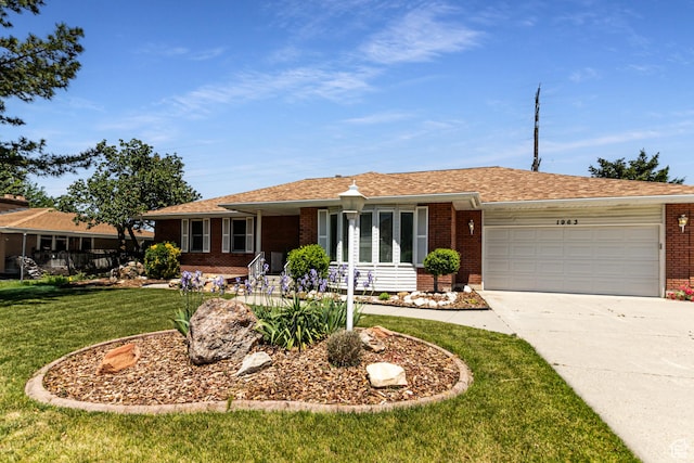 1963 E Rio Way E, Sandy, UT 84093 - ranch-style home with brick siding, an attached garage, concrete driveway, and a front lawn