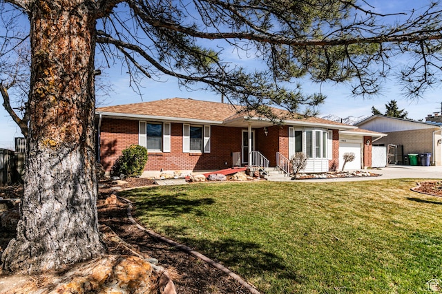 ranch-style home featuring brick siding, concrete driveway, roof with shingles, an attached garage, and a front yard