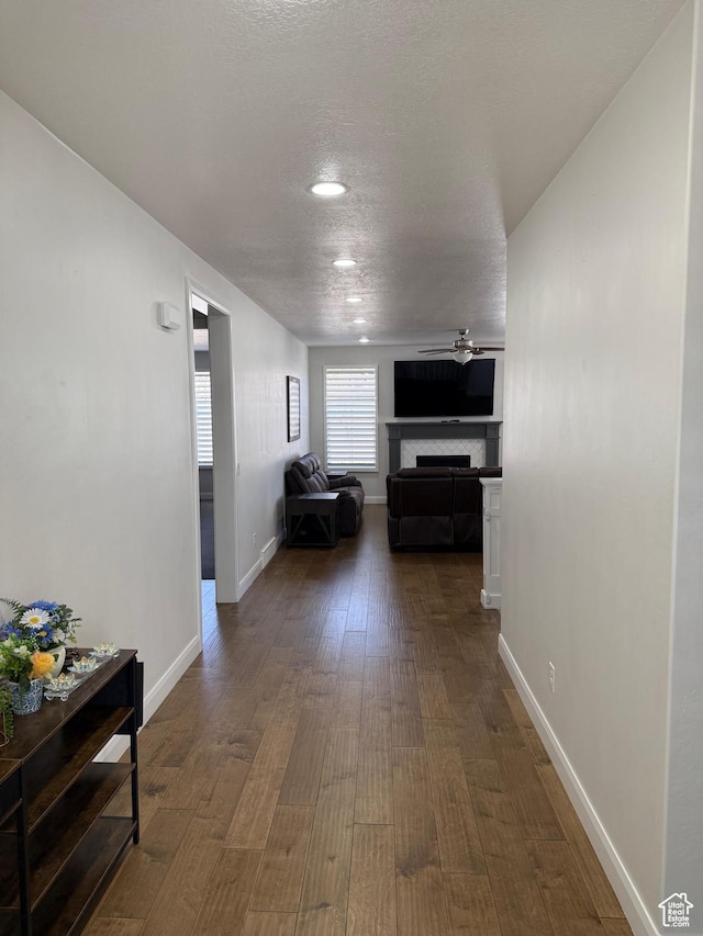 13592 S Conie Bell Dr, Herriman, UT 84096 - hall with dark wood-type flooring, a textured ceiling, and baseboards