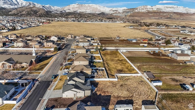 birds eye view of property featuring a mountain view and a residential view