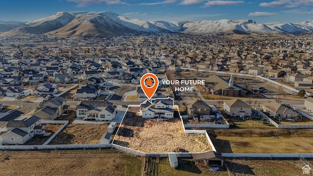 drone / aerial view featuring a residential view and a mountain view