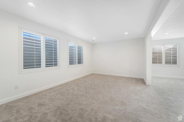 unfurnished room with recessed lighting, baseboards, and carpet floors