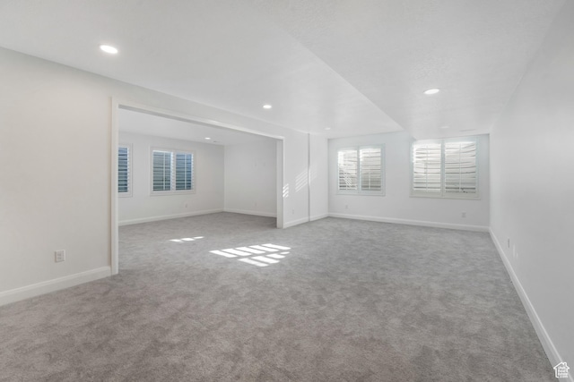 unfurnished room with recessed lighting, baseboards, and carpet floors