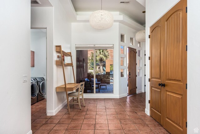 340 N Snow Canyon Dr Unit 4, Ivins, UT 84738 - entrance foyer with baseboards, light tile patterned flooring, visible vents, and washer and dryer