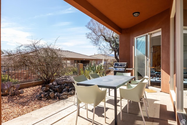 340 N Snow Canyon Dr Unit 4, Ivins, UT 84738 - view of patio with a grill, fence, and outdoor dining space