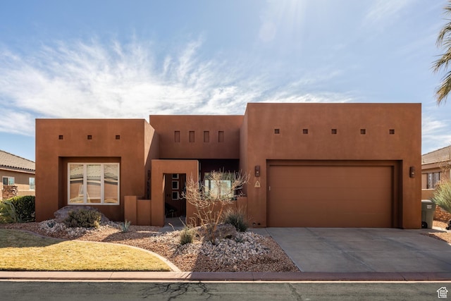 340 N Snow Canyon Dr Unit 4, Ivins, UT 84738 - southwest-style home with an attached garage, concrete driveway, and stucco siding