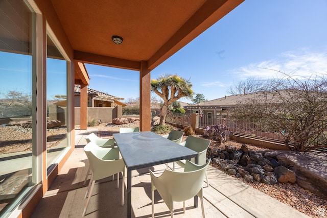 340 N Snow Canyon Dr Unit 4, Ivins, UT 84738 - view of patio featuring outdoor dining area and fence